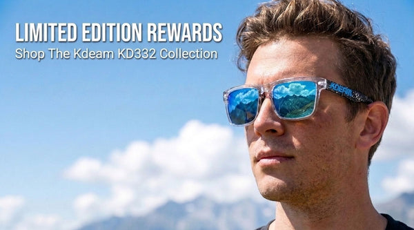 A man wearing blue mirrored sunglasses with patterned temple arms, set against a bright blue sky and distant mountains. Text on the top left reads 'LIMITED EDITION REWARDS Shop The Kdeam KD332 Collection'.